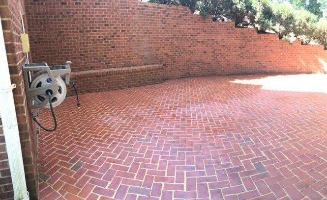 Herringbone brick patio back to bright red after washing