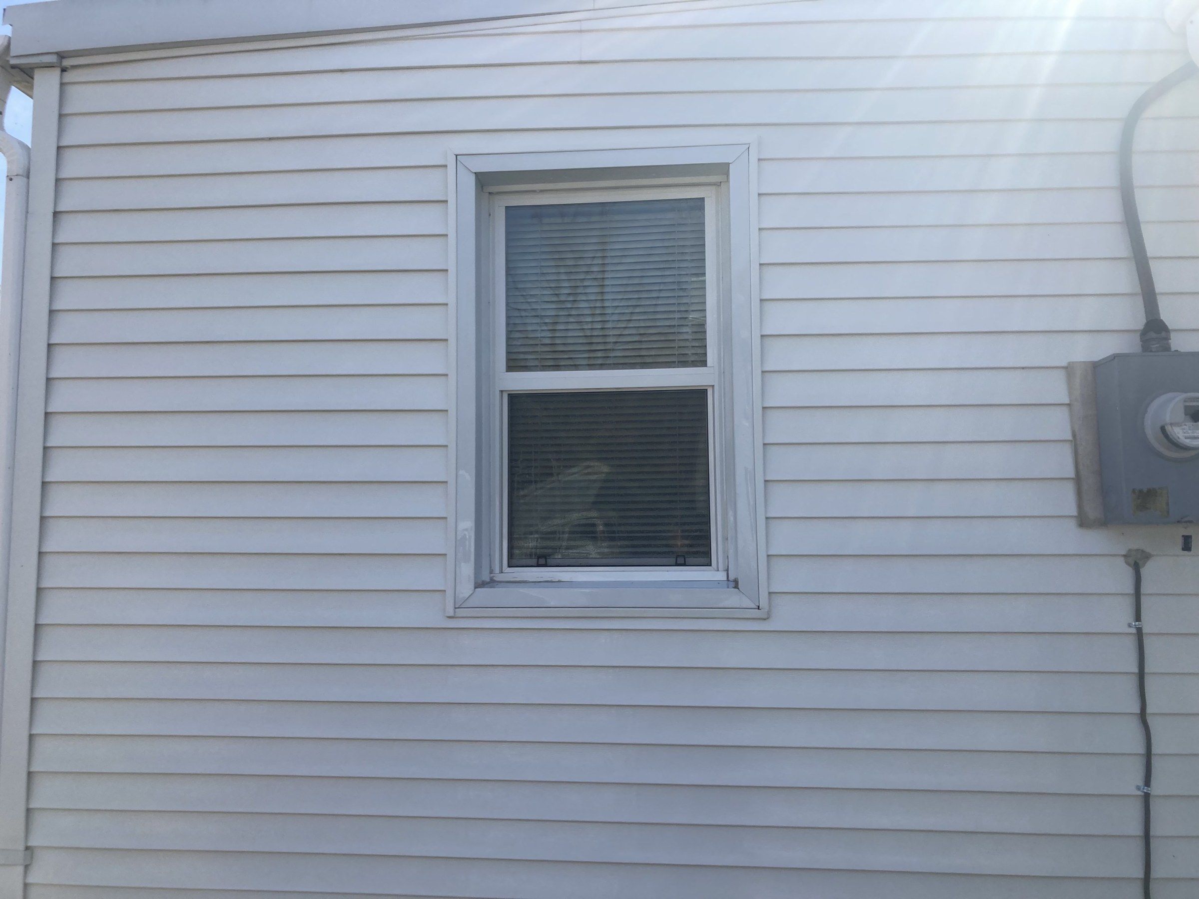 The same white vinyl wall and window clean after washing