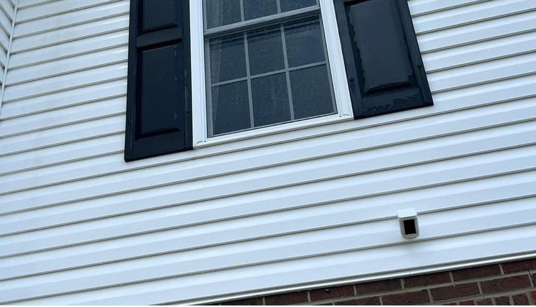 The same siding after washing, clean and white